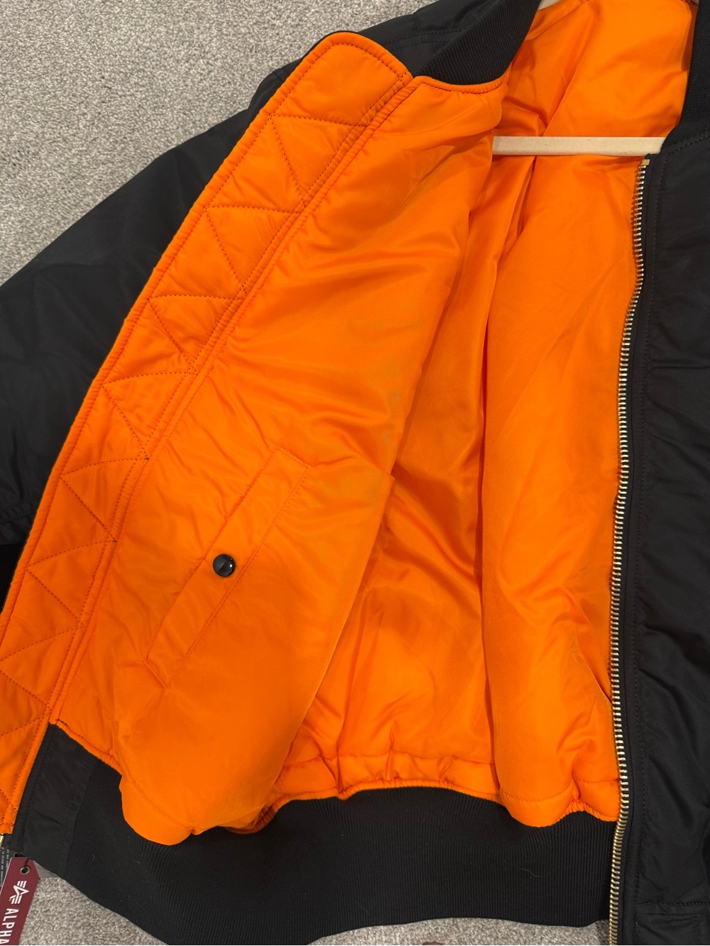 Alpha Industries Black Bomber Jacket with Orange Lining and Red Zip Tag - Picture 4 of 7